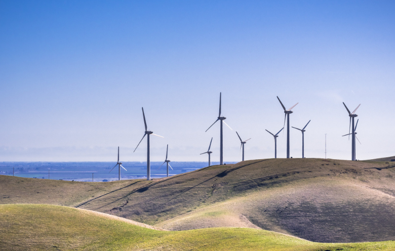 Wind turbines on the hills of east San Francisco bay, Stockton valley in the background, Alameda county, California