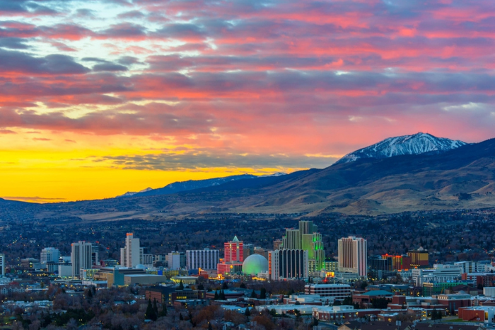 Reno Radiant Dawn: Panoramic 4K View of the Nevada City at Sunrise with Cloudy Sky