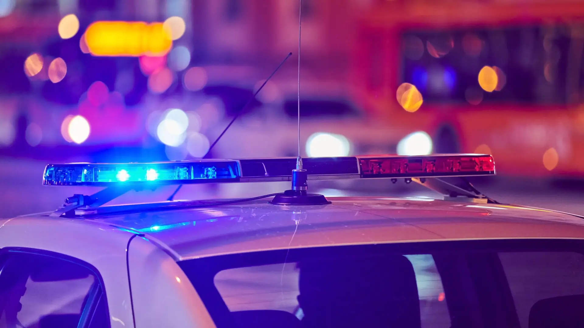 Texas drivers at the scene of a car accident with police and insurance forms visible