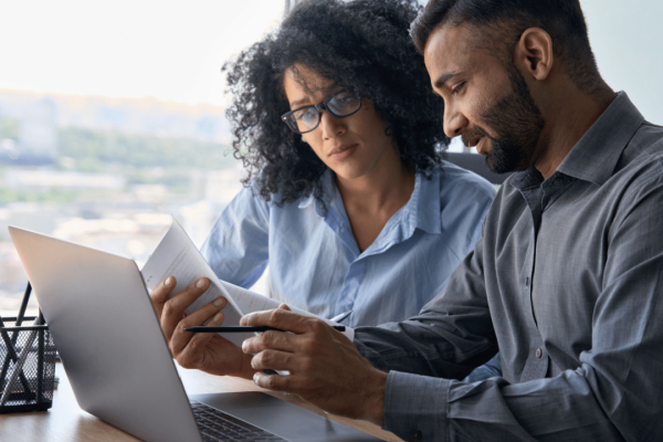 Texas attorney consulting with car accident victim about settlement calculator options in modern law office
