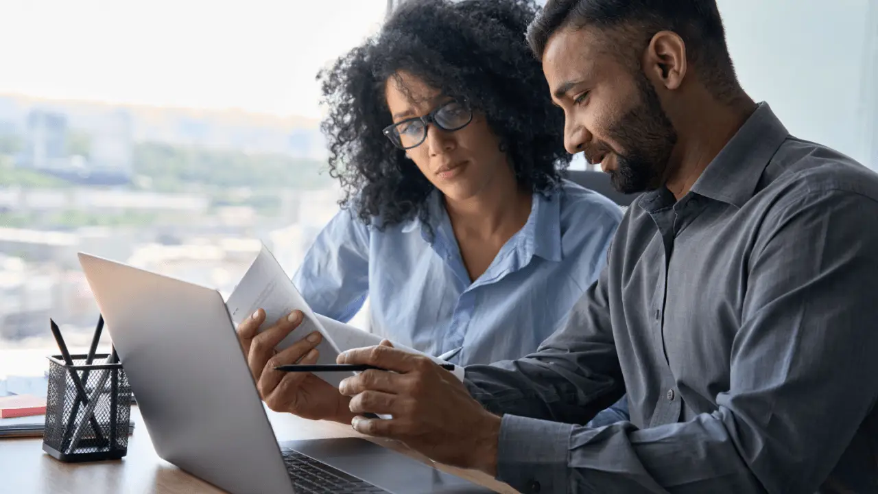 Texas attorney consulting with car accident victim about settlement calculator options in modern law office