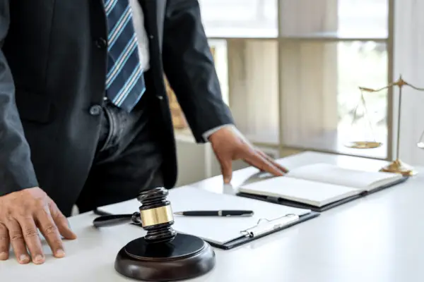 Lawyer reviewing documents when to hire a lawyer for an insurance claim legal consultation