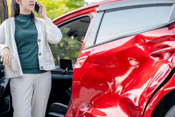 Woman calling lawyer after car accident wondering how long do you have to contact a lawyer after an accident