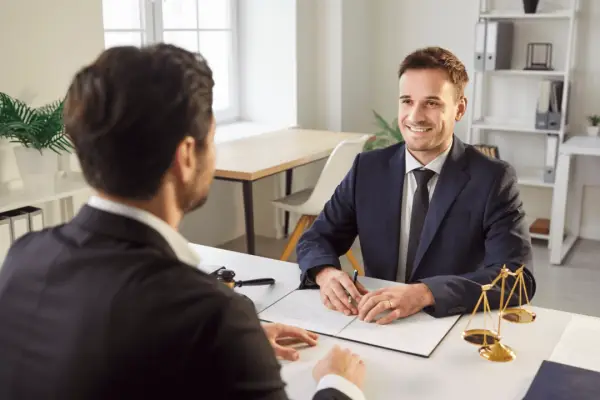 Client consultation meeting showing how to choose the best personal injury lawyer for your case