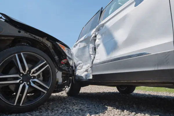 Car accident damage showing how to settle an injury claim without a lawyer documentation needs