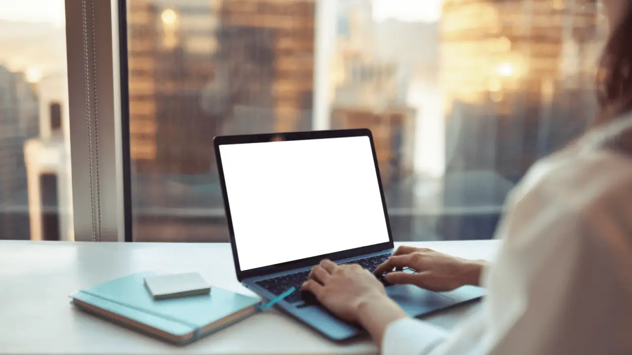 Person researching how much should I ask for a settlement on laptop computer