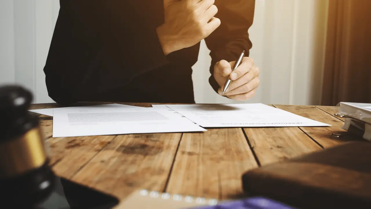 Personal injury lawyer reviewing case documents to determine do personal injury lawyers take cases they cant win