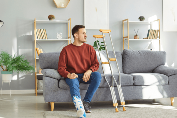 Injured motorcycle accident victim with leg cast contemplating how much compensation for anxiety after a motorcycle accident