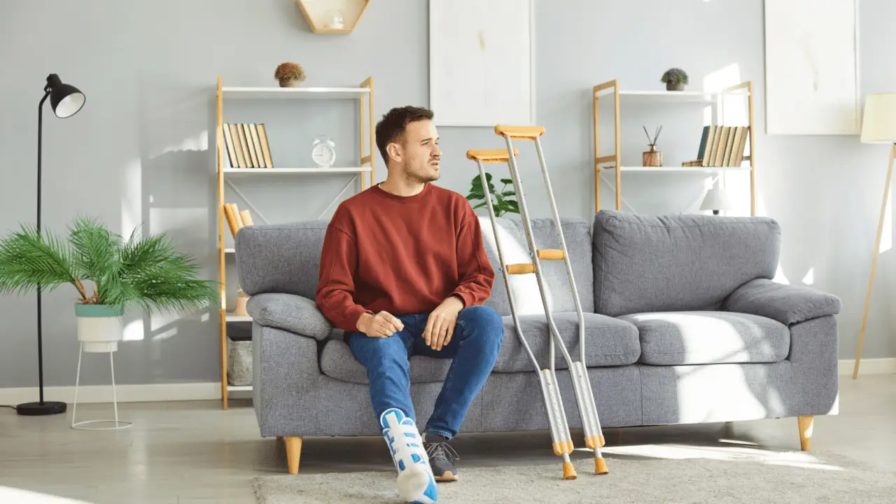 Injured motorcycle accident victim with leg cast contemplating how much compensation for anxiety after a motorcycle accident