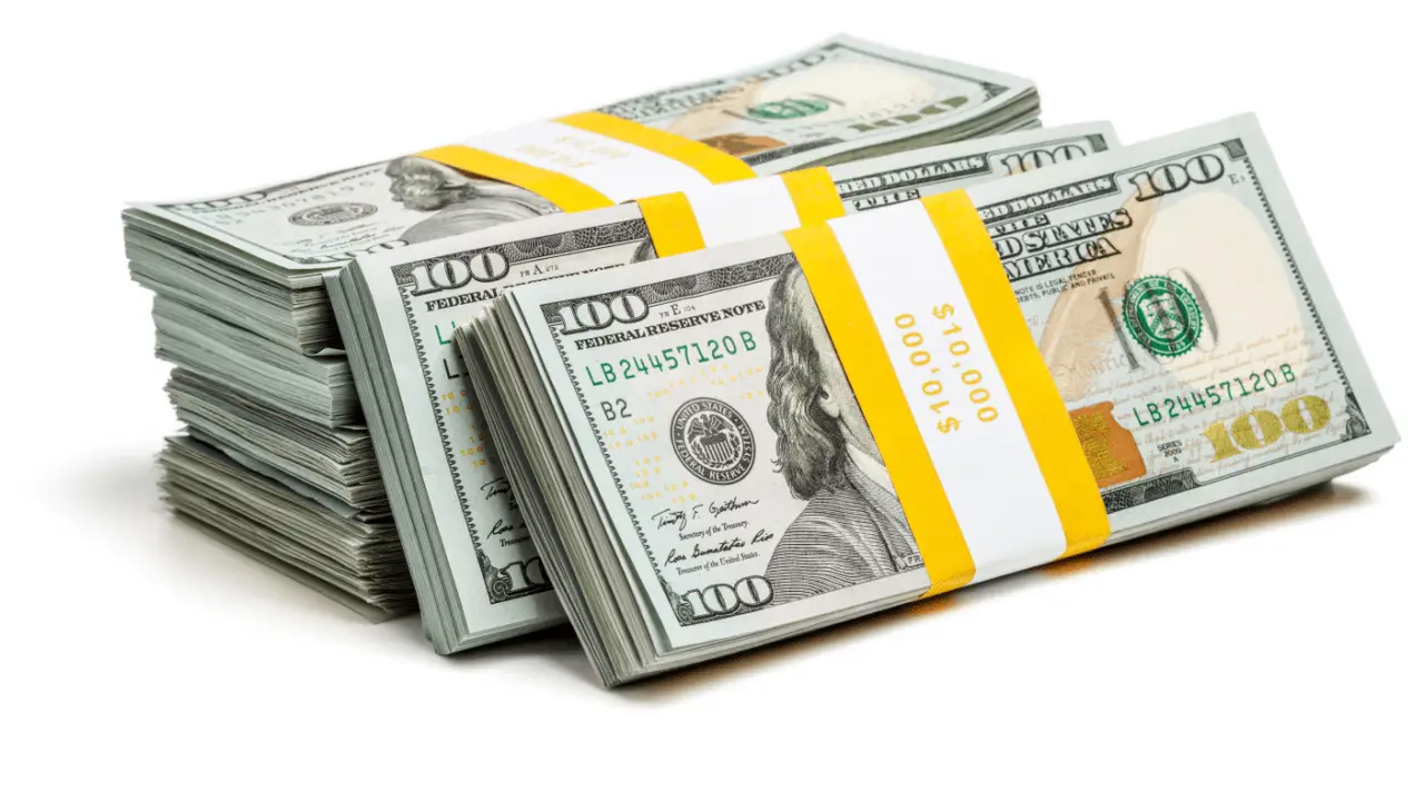 Stacks of hundred dollar bills representing how much money should I ask for in a settlement