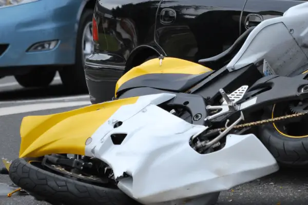 Should I get a lawyer after a motorcycle accident - damaged motorcycle on road after collision