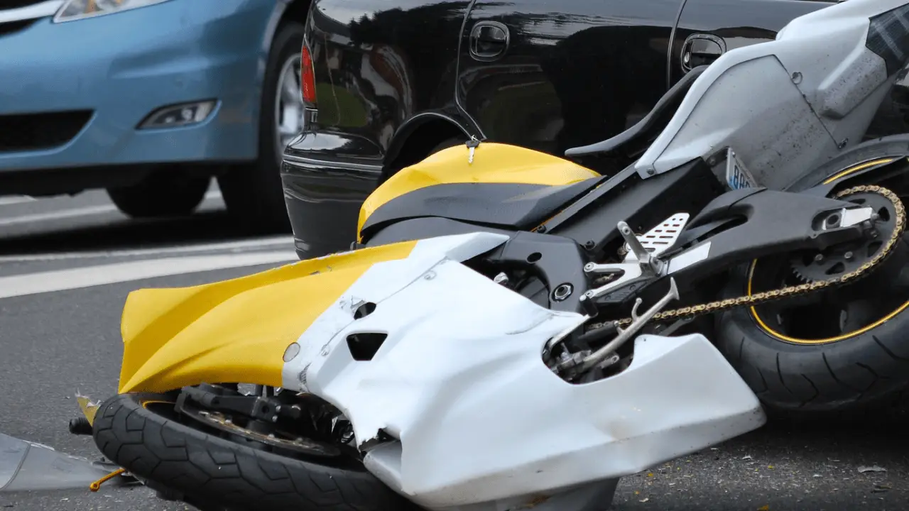 Should I get a lawyer after a motorcycle accident - damaged motorcycle on road after collision