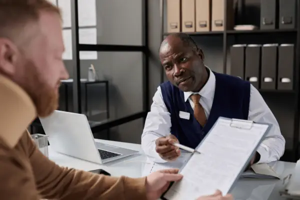 Motorcycle accident lawyer reviewing case documents with client during consultation