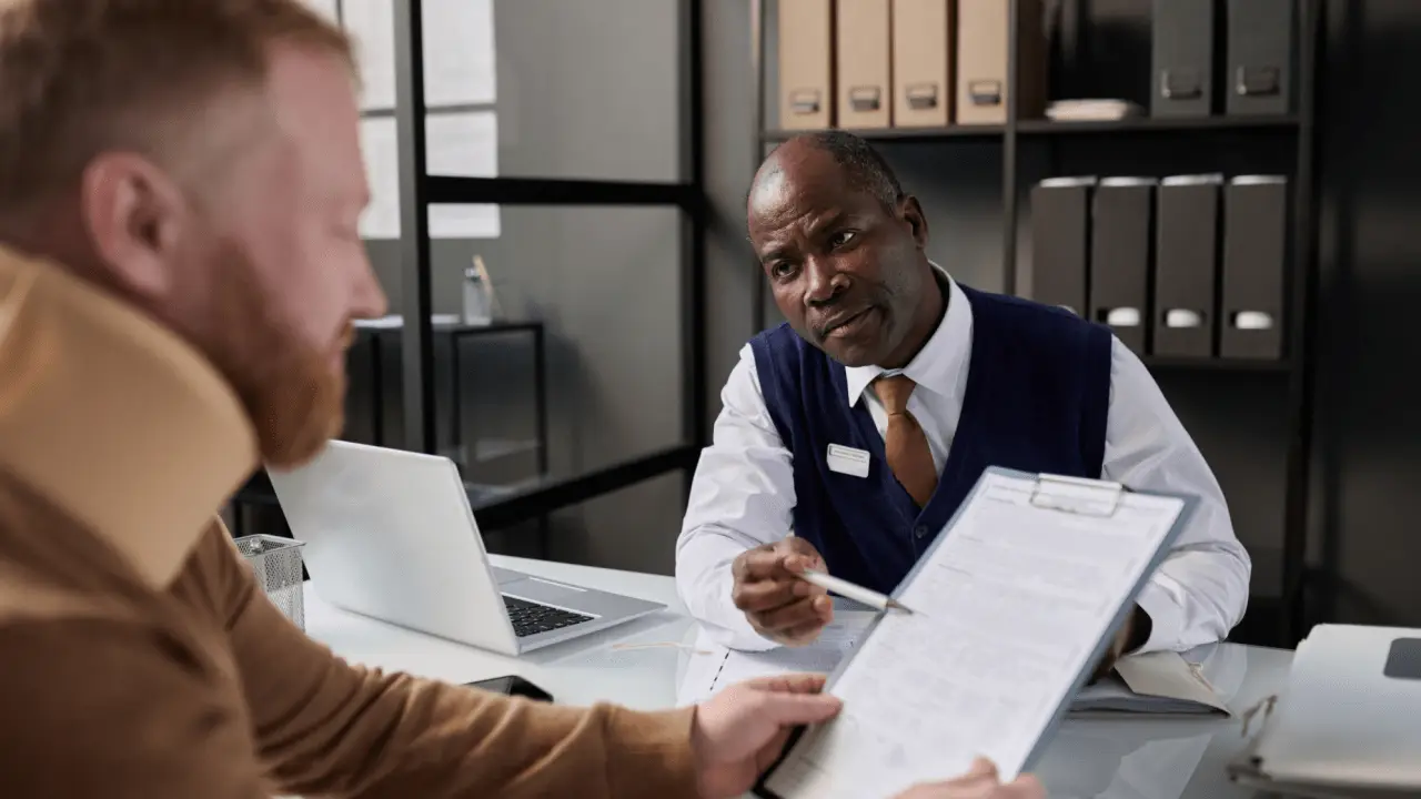 Motorcycle accident lawyer reviewing case documents with client during consultation