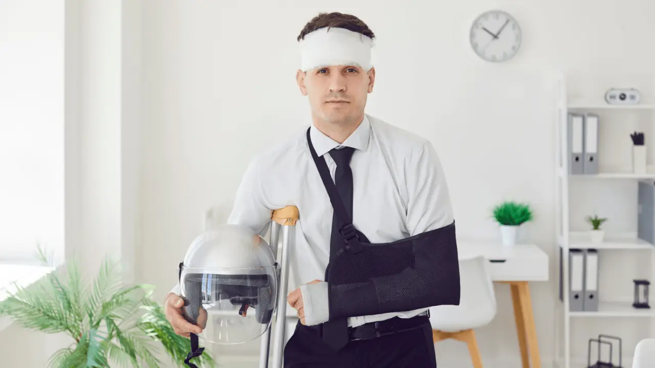 Injured motorcycle accident victim with arm sling and head bandage considering what is the average payout for a motorcycle accident settlement