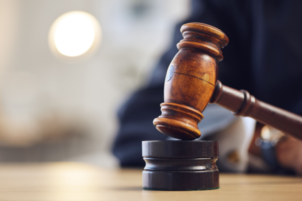 Wooden gavel representing courtroom decisions for what percentage of car accident cases go to trial