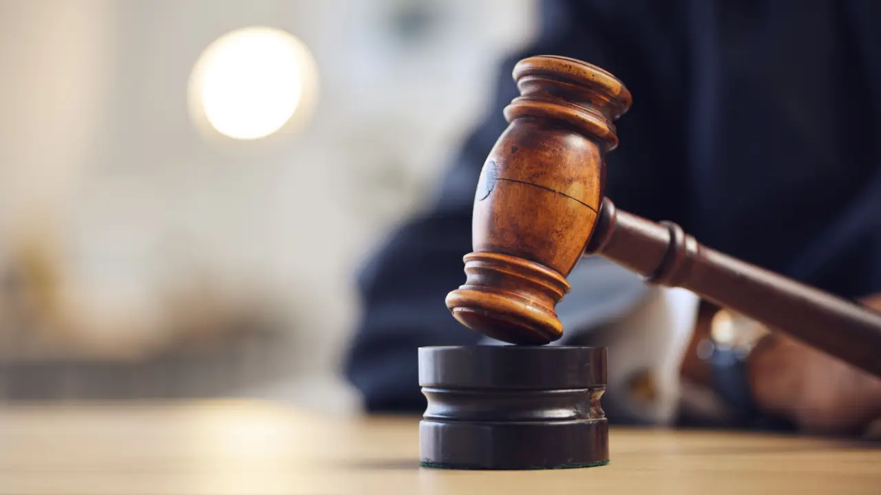 Wooden gavel representing courtroom decisions for what percentage of car accident cases go to trial