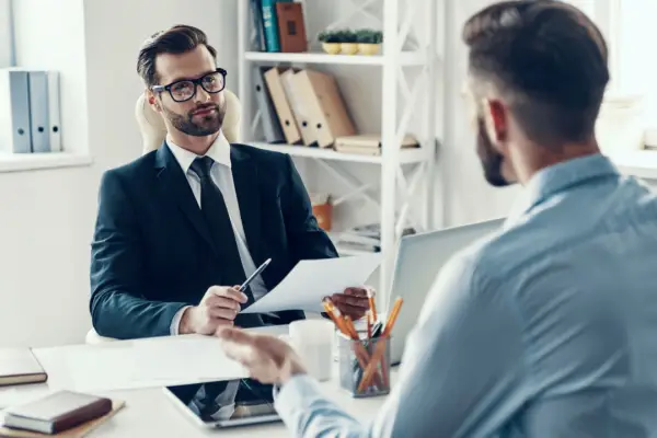 Motorcycle accident lawyer discussing settlements in motorcycle accidents with client during consultation meeting