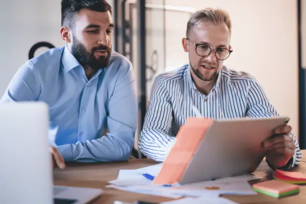 Bicycle accident lawyers reviewing case documents and legal information with client during consultation