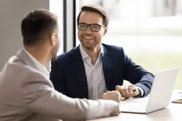 Professional lawyer with client during bicycle accident legal process consultation in office