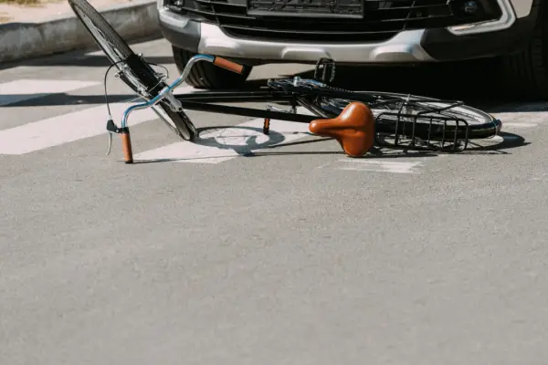 Bicycle lying on street after collision with car in Chicago showing what to do after a bicycle accident in Chicago