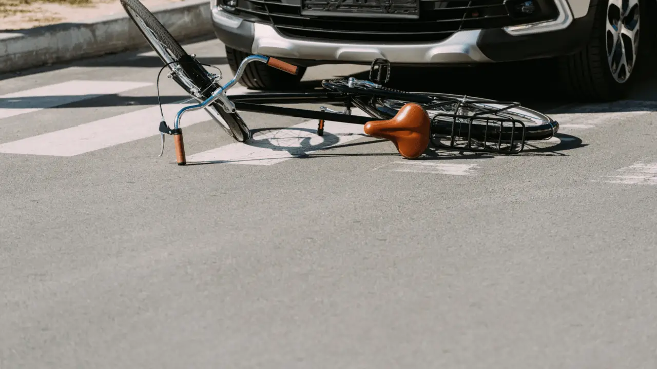 Bicycle lying on street after collision with car in Chicago showing what to do after a bicycle accident in Chicago