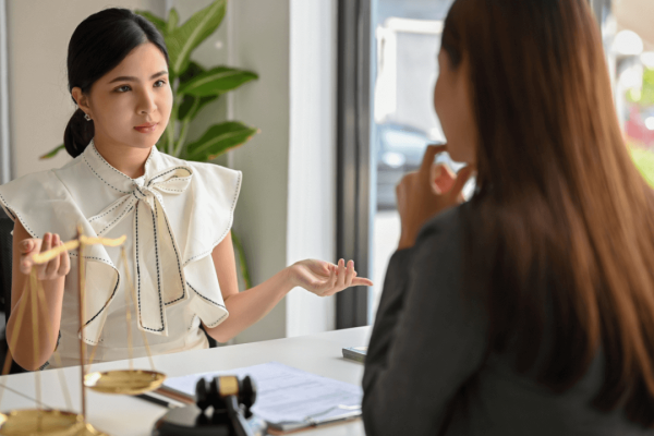 Attorney and client consultation discussing is there anything you shouldn't tell your lawyer during legal case review