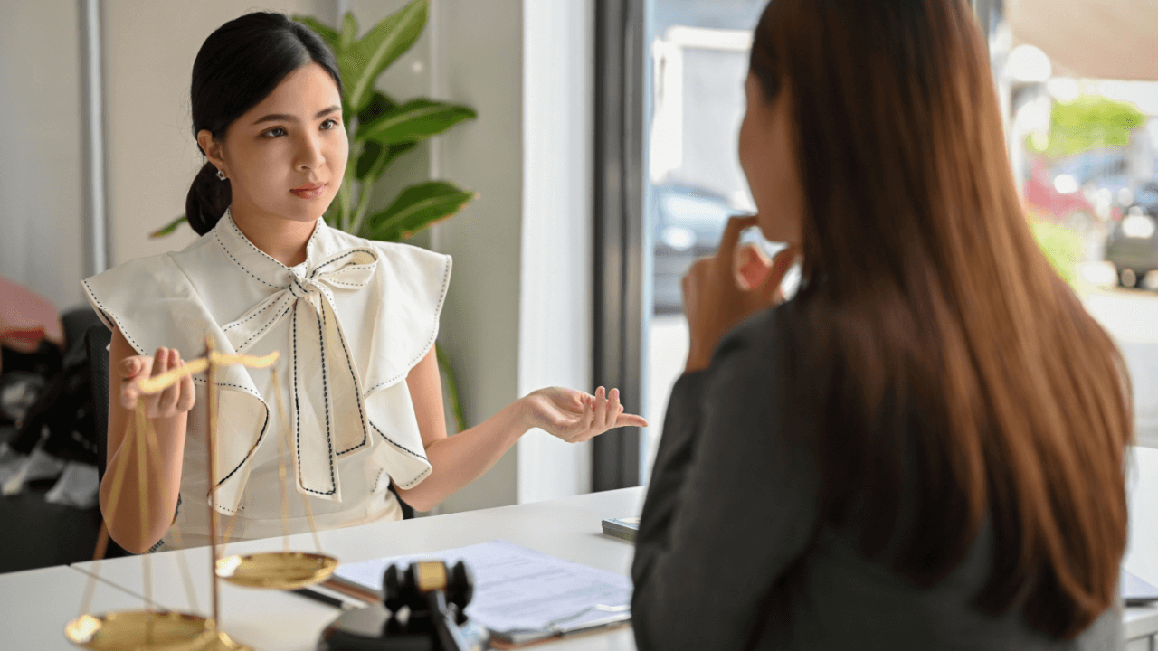 Attorney and client consultation discussing is there anything you shouldn't tell your lawyer during legal case review