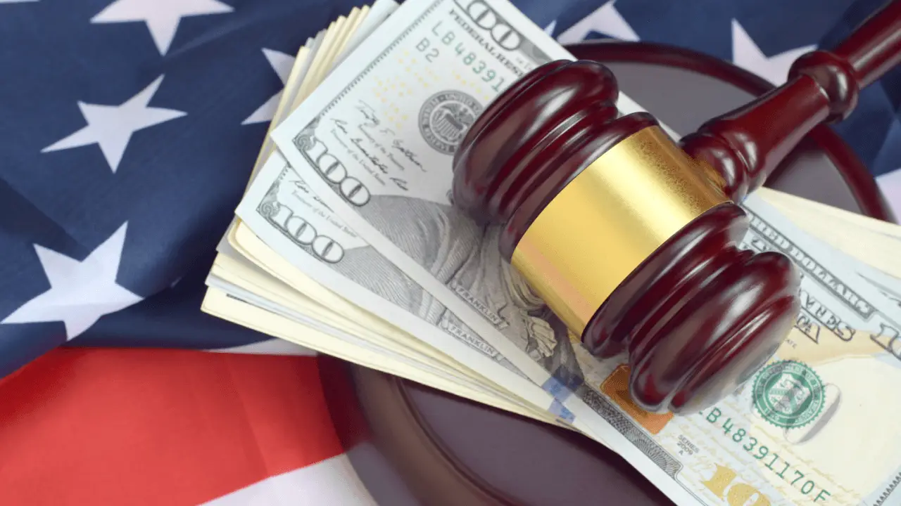 Judge's gavel on stack of hundred dollar bills with American flag representing what affects attorney fees in personal injury claims