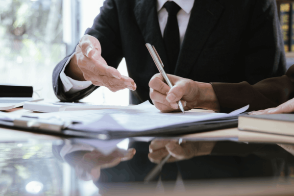 Attorney and client reviewing legal documents to evaluate what are signs of a good settlement offer in personal injury case