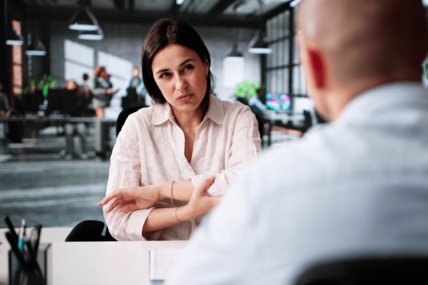 Client consulting with attorney in modern office discussing what is a typical amount of pain and suffering compensation