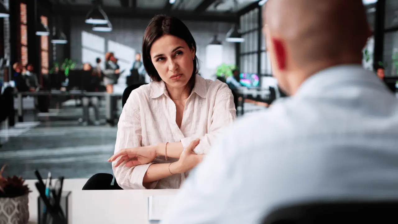 Client consulting with attorney in modern office discussing what is a typical amount of pain and suffering compensation