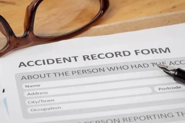 Filing a claim after a truck accident requires completing accident record forms with detailed collision information and injury documentation