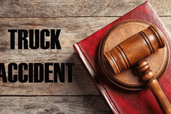 Steps in a truck accident claim legal representation with gavel and law book