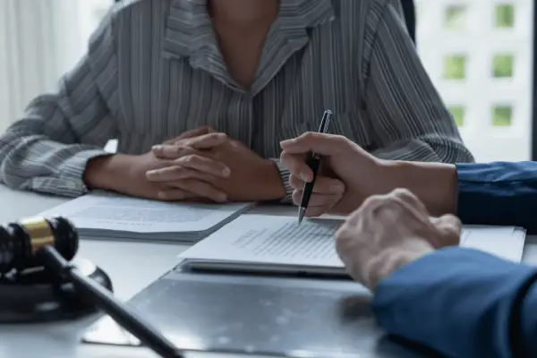 Truck accident lawyer reviewing claim documents with client during legal consultation
