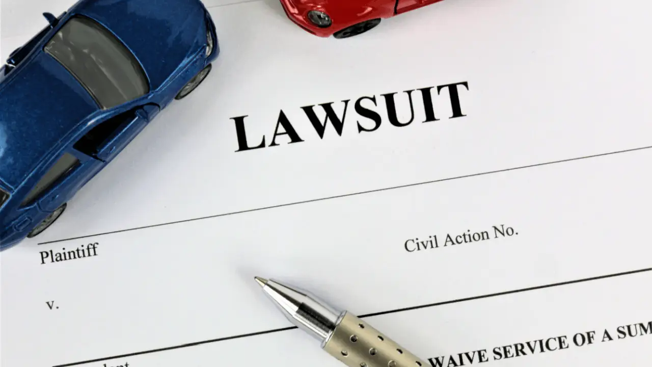 Truck accident lawsuit process documents with toy vehicles showing plaintiff versus defendant civil action filing