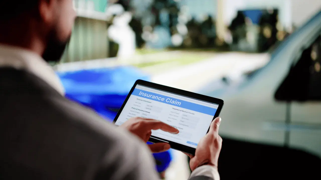 insurance claim mistakes on tablet after car accident
