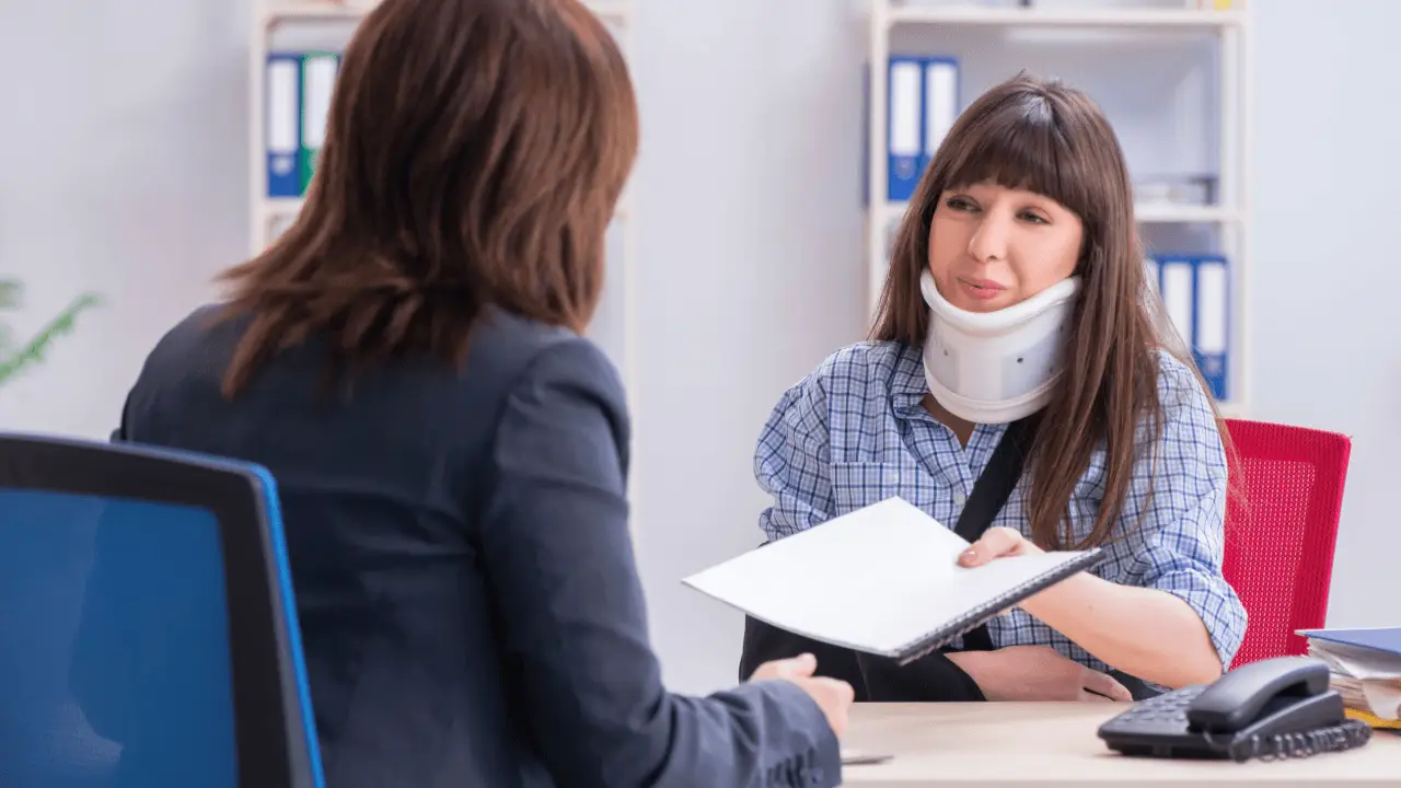 car accident claim process consultation with injured woman and professional